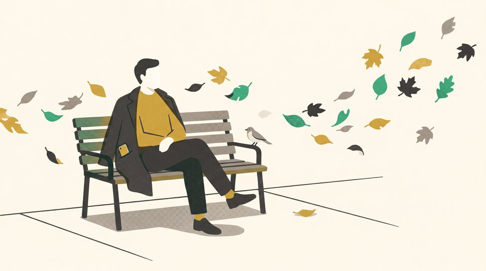 A person sitting calmly on a park bench, phone in pocket, leaves blowing past, a small bird on the armrest